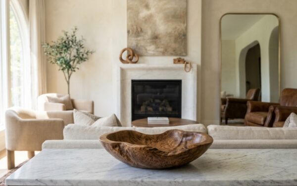 Styling handcrafted wooden decor brings an organic, sophisticated warmth to modern luxury interiors.